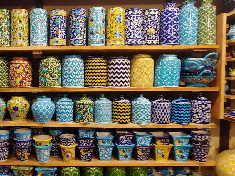 Shelves of hand-painted Jaipur blue pottery jars and vases